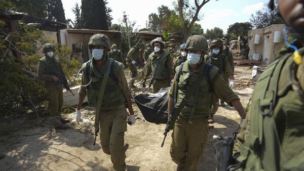 Israeli village near Gaza border lies in ruins, filled with bodies